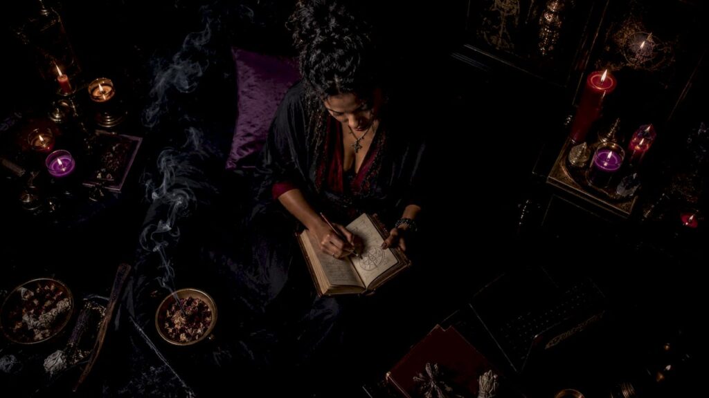 Woman journaling spiritual signs in meditation room