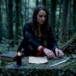 Practitioner preparing demonic invocation ritual