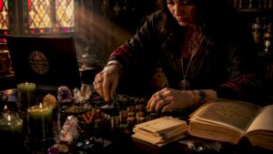 Person arranging materials for money spell ritual