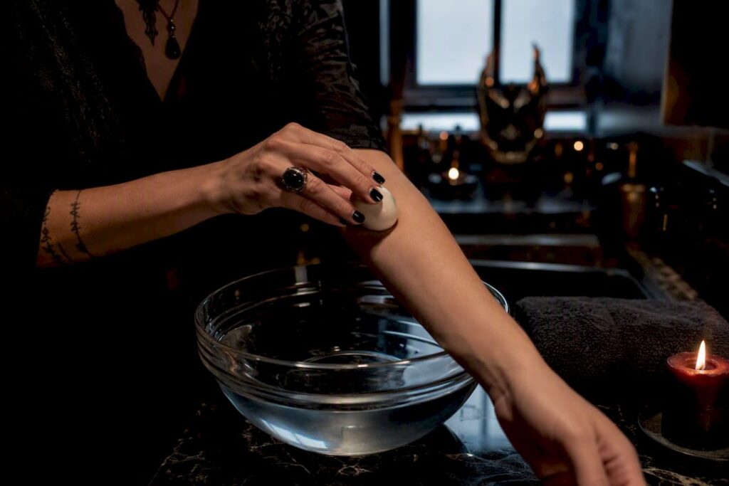Practitioner performing an egg cleansing ritual